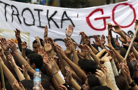 Students take part in an anti-Troika protest outside the Presidencial palace in Nicosia